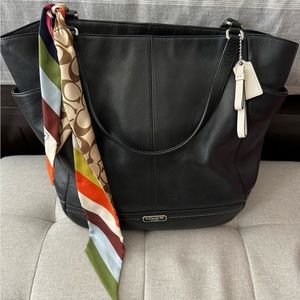 Coach purse with signature stripe scarf.